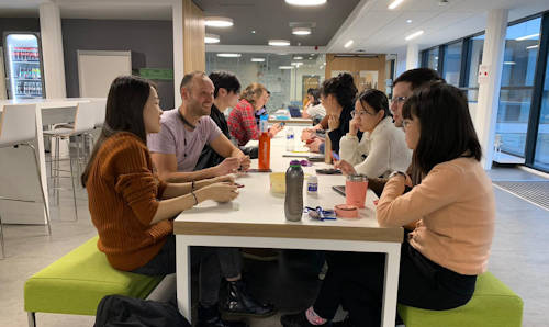Students in discussion in Lime Cafe on campus