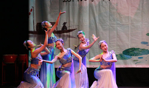 Dancers onstage performing at a gala